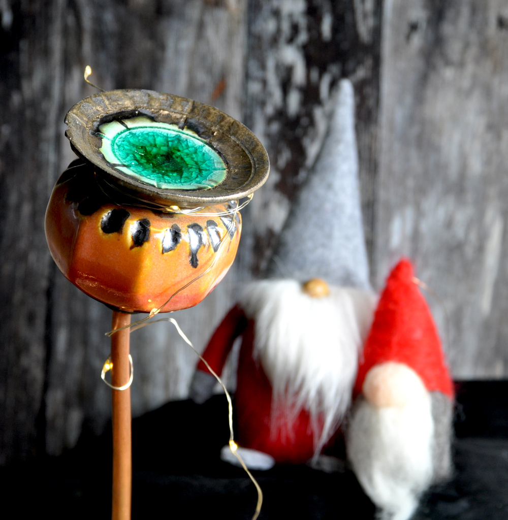 Orange poppy seed head with Christmas gongs
