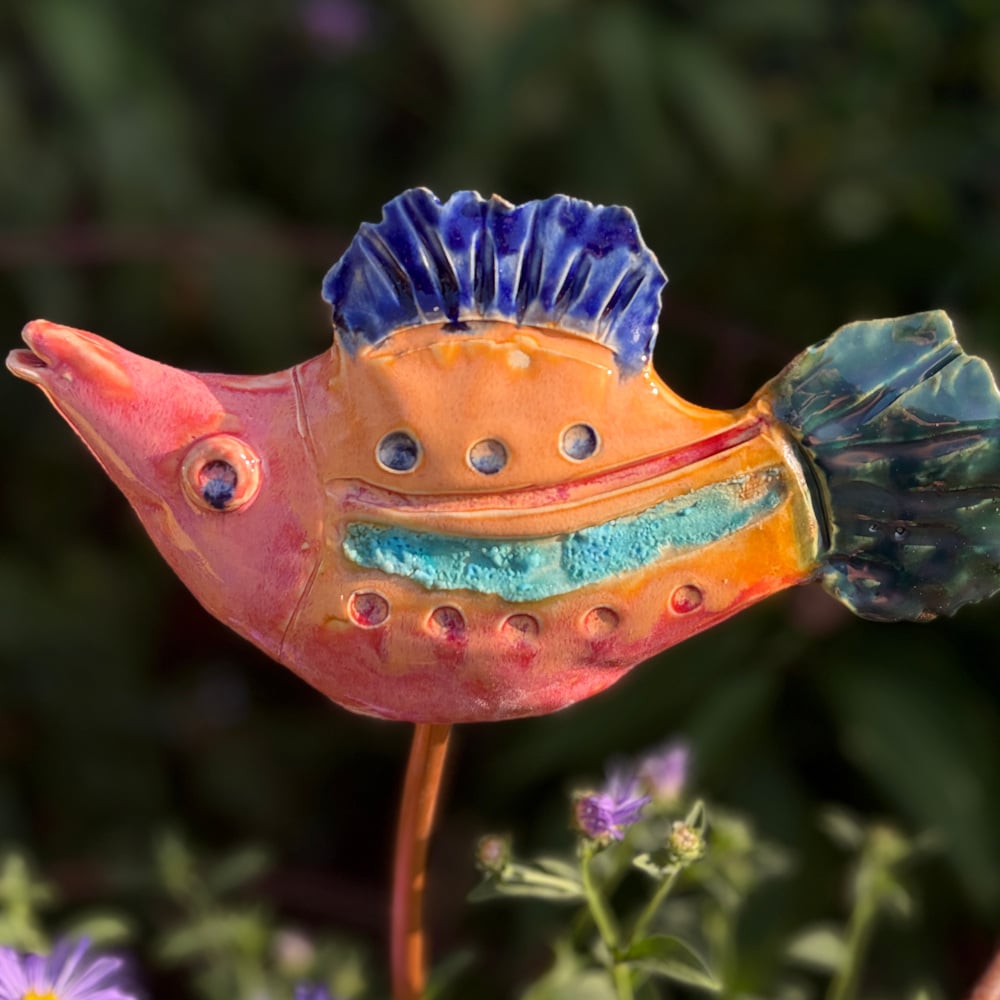 Tropical fish "Grace", glazed in bright colours, sitting on a copper rod