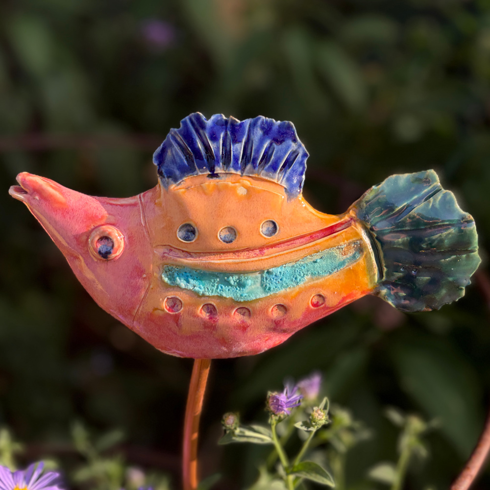 Tropical fish "Grace", glazed in bright colours, sitting on a copper rod