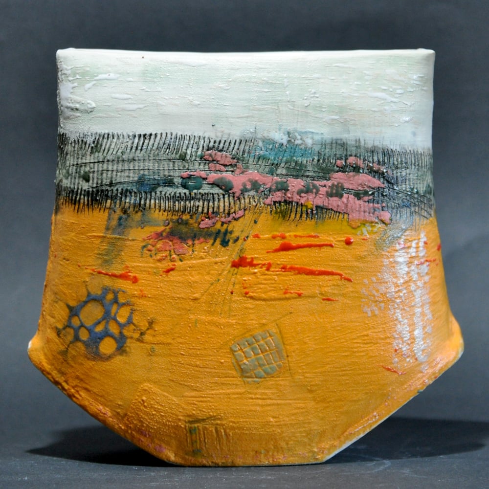 Engobe decorated pivot Vase, decorated with orange and white engobes, glazes, ceramic pencils and wax crayons