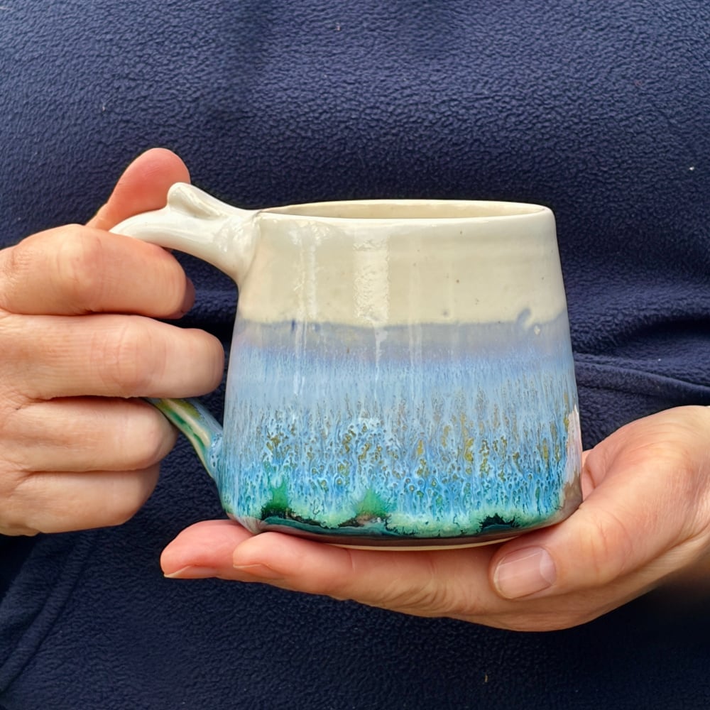 Hugging a small horizon mug
